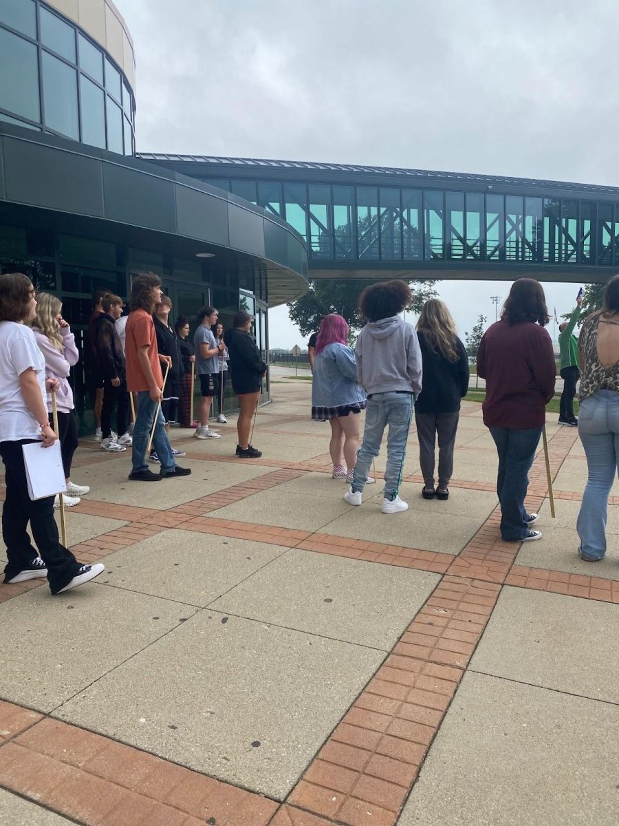 MMR students listen to quick instruction at the AC before collecting needed data.  