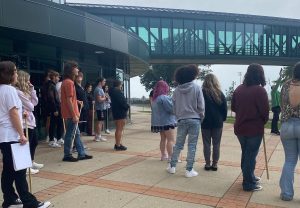 MMR students listen to quick instruction at the AC before collecting needed data.  