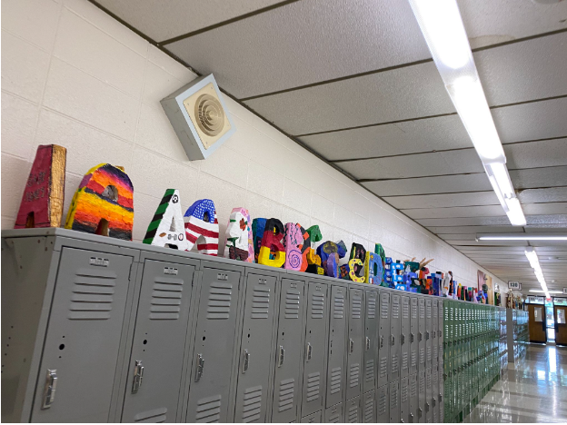 Art projects on display on top of lockers. 