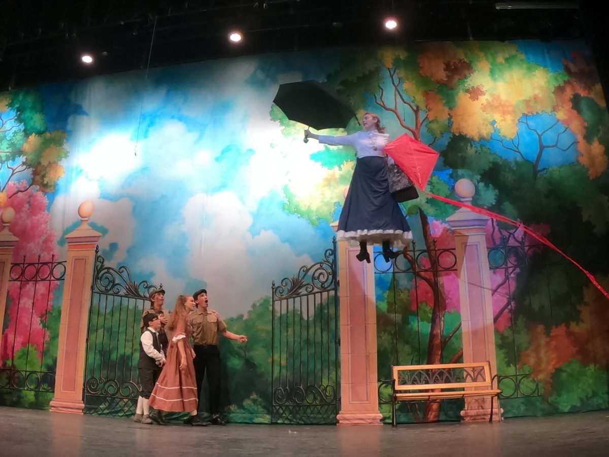 Mary Poppins flies in during 'Let's Go Fly a Kite'