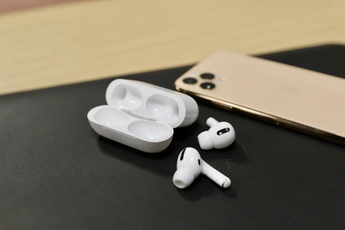 A pair of Airpods and a phone