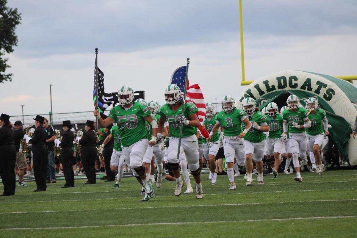 Harrison Wildcats storming the field before kickoff against Indian Hill.