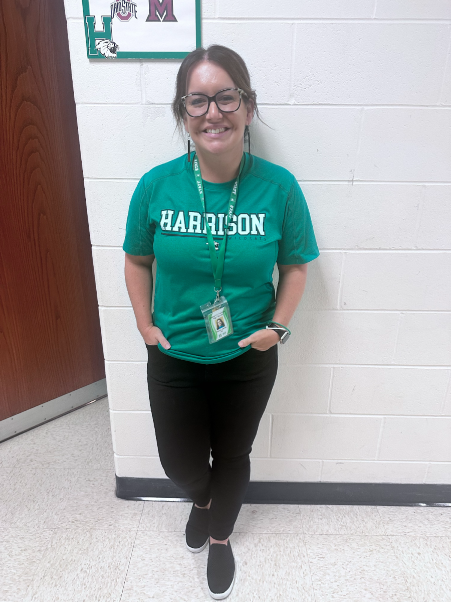 Mrs. Jones lights up the hallway outside her classroom. 