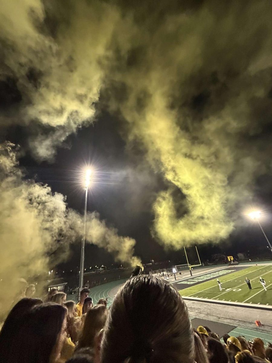 Harrison student section showing their support for special education with a yellow out for inclusion week. 