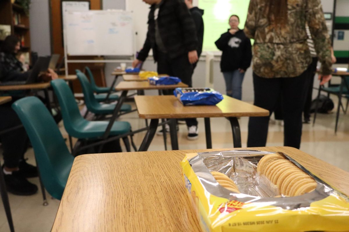 Harrison Paw Print staff testing Oreo flavors