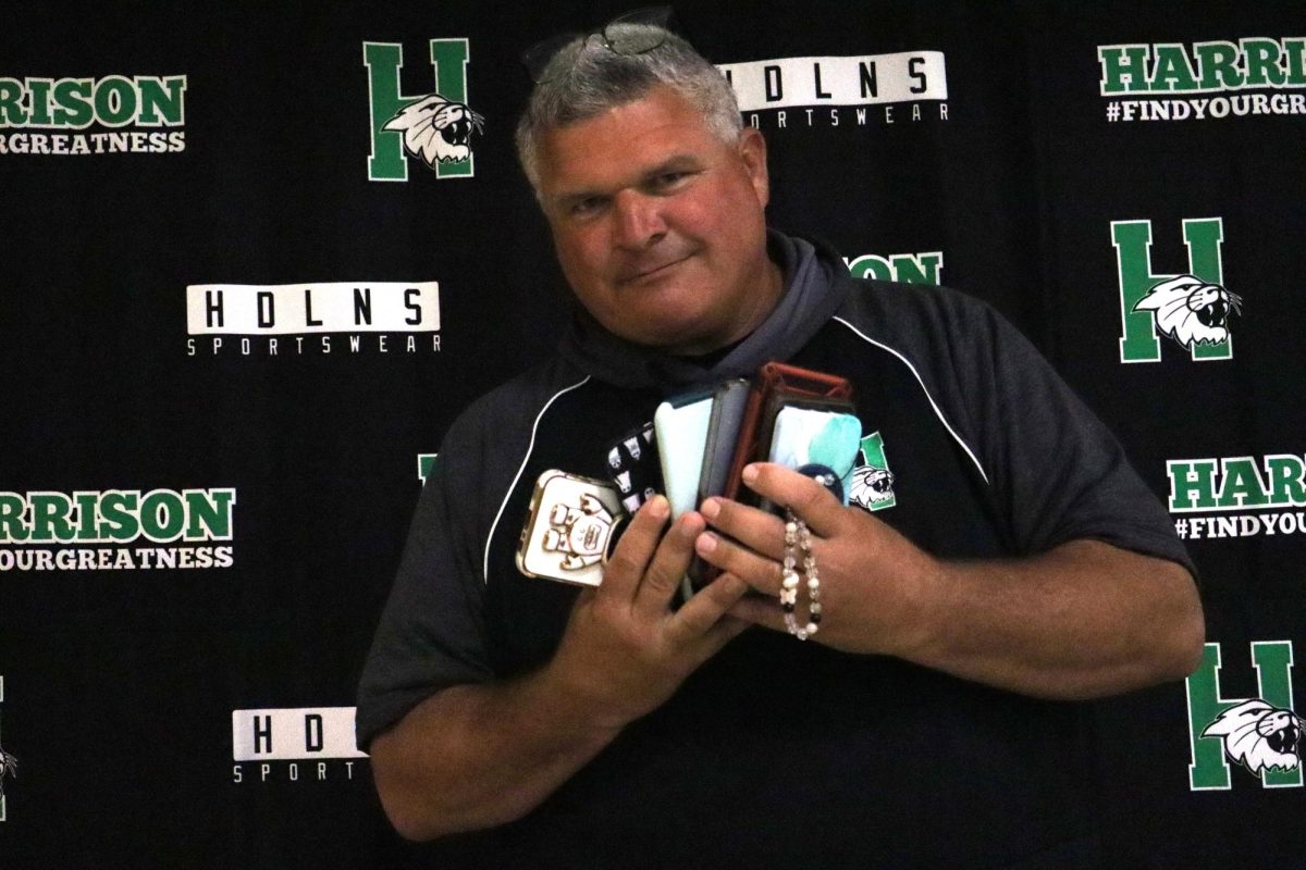 Mr. Roth with a collection of phones from A lunch
