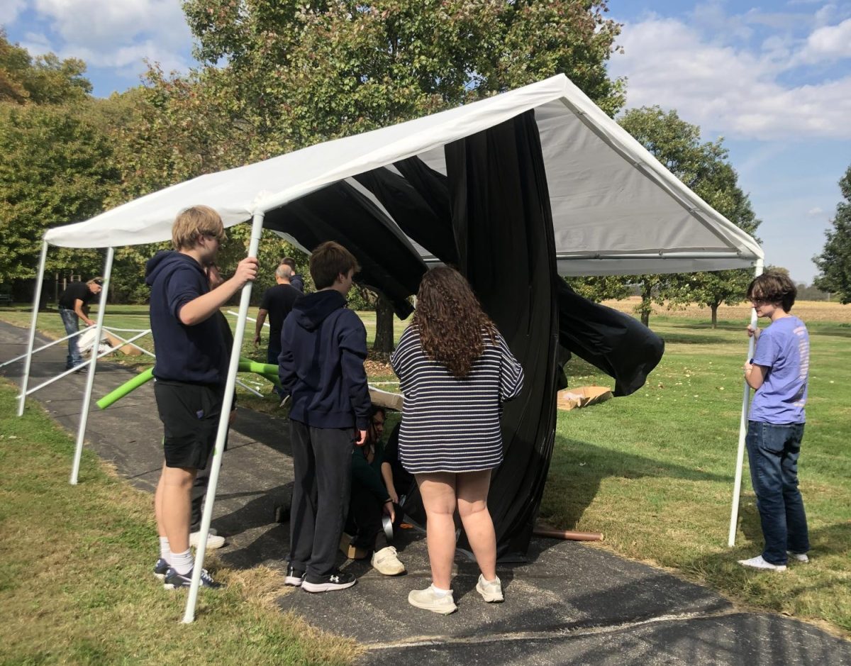 CAT members setting up a tent