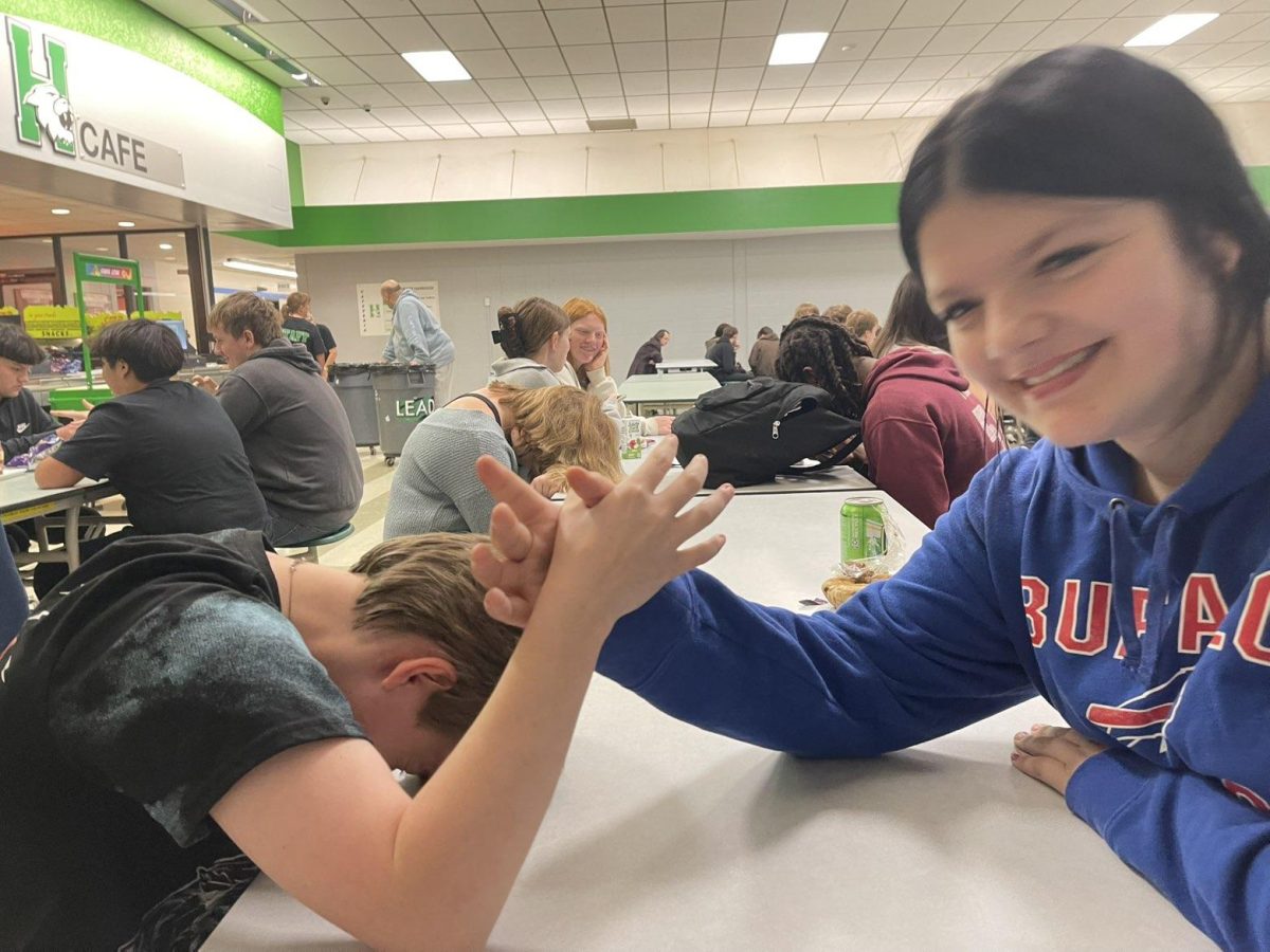 Stewart and his friend Lana goofing around during the arm-wrestling match. 