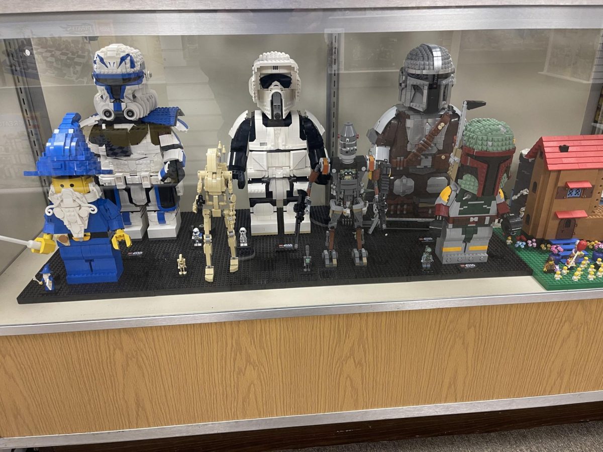A set of minifigures and larger built counterparts