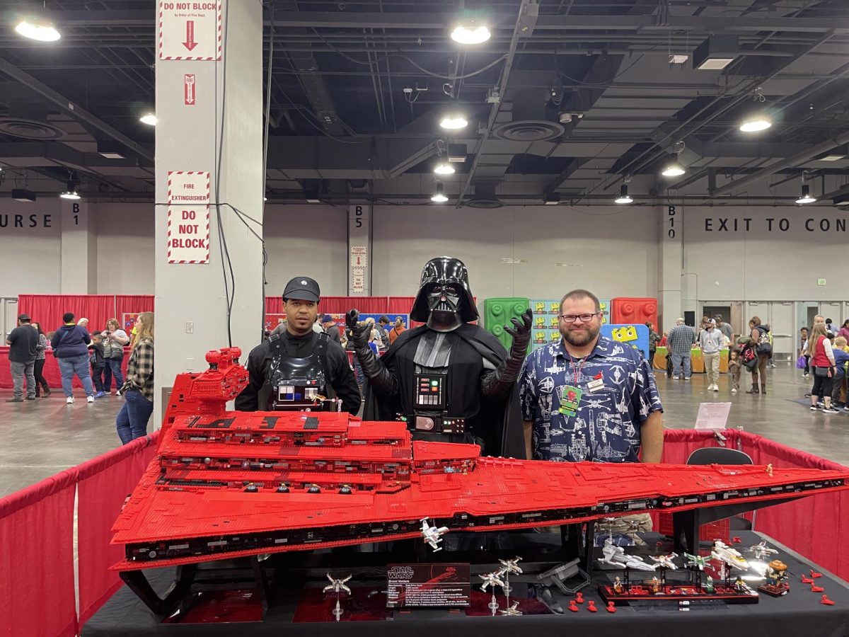 Brian Egan posing with Darth Vader behind his Errant Venture