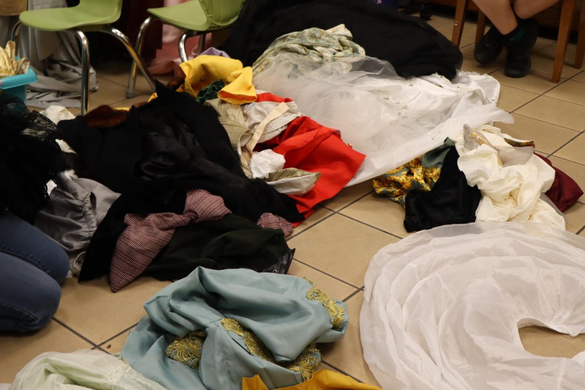Dozens of costumes overflood the greenroom! (Don't worry, they were picked up later!)
