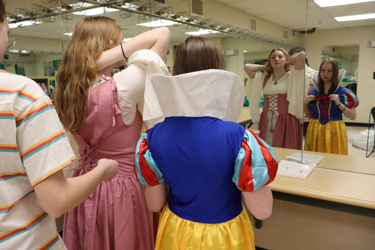 Actors Liv Daniel and Karlie Farris get into costumes for costume check day