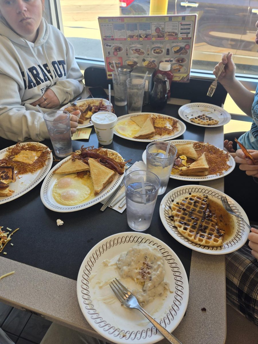 Chy and her family trying to fit everything on one table because there were too many people at Waffle House when they came in (all of which mysteriously disappeared after they were seated)